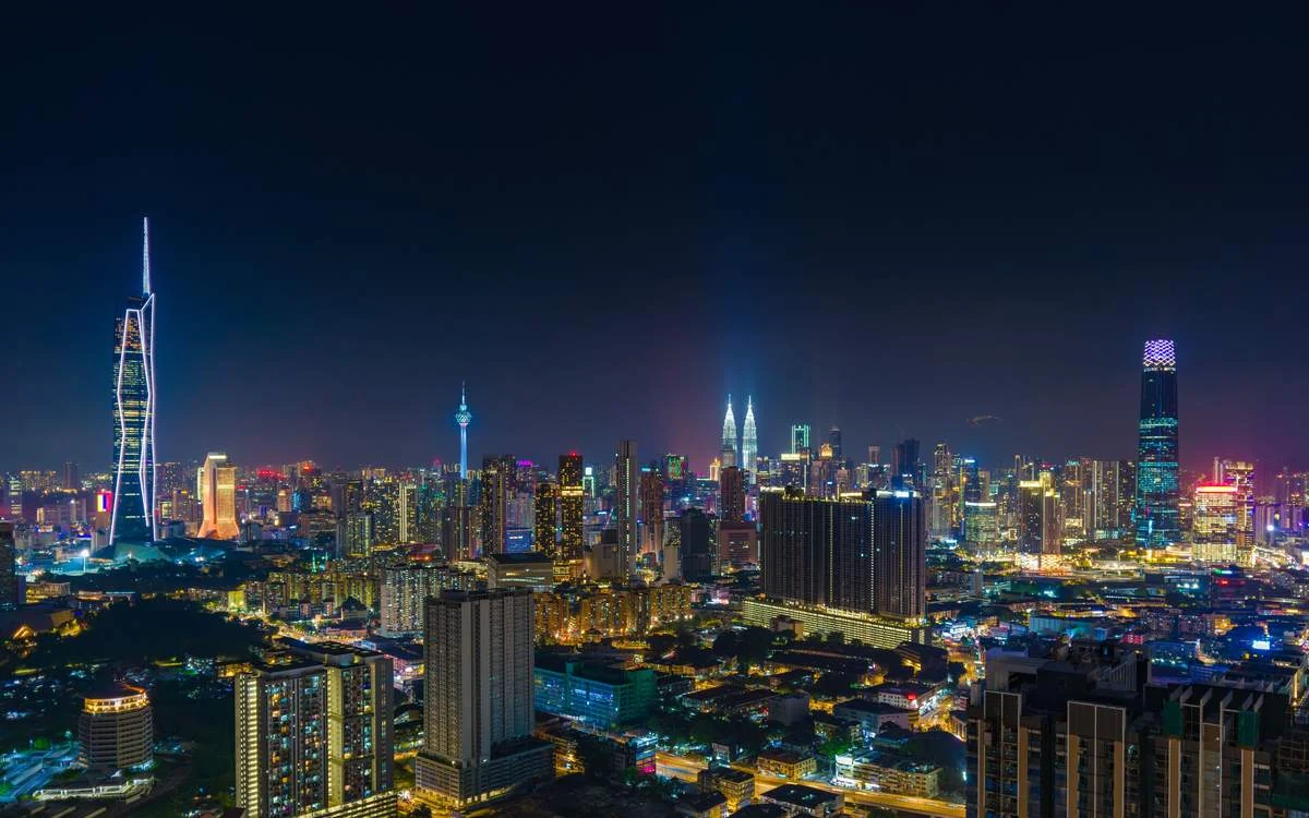 Kuala Lumpur skyline at night with Merdeka 118 lit up