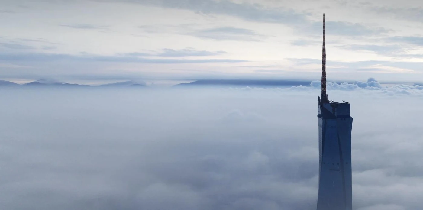 Merdeka 118 rising above a layer of cloud